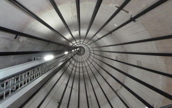 Inside view of a wind turbine tower, showing the tendon cables.